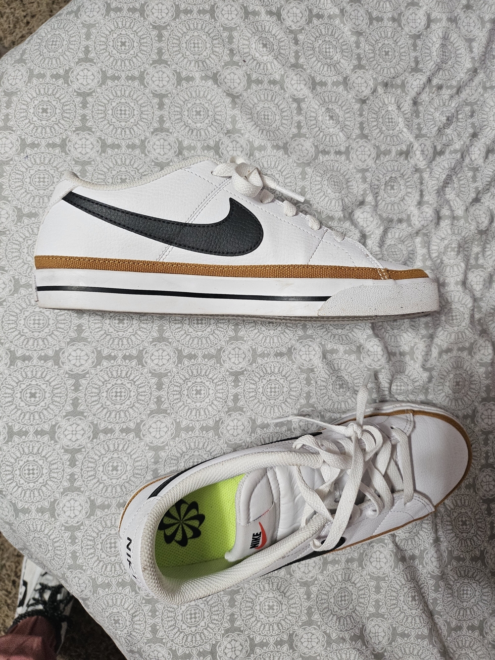 Nike White Low-Top Sneakers with Black Swoosh and Brown Trim